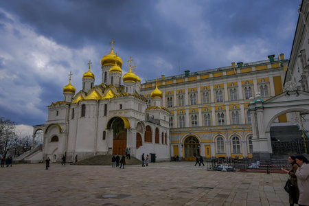 MOSCOW, RUSSIA- APRIL, 24, 2018: Unidentified people in front of golden Annunciation Cathedral or Cathedral of the Assumption on the north side of Cathedral Square of the Moscow Kremlin in Moscowのeditorial素材