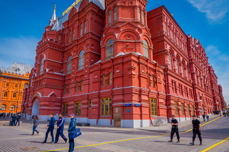 MOSCOW, RUSSIA- APRIL, 29, 2018: Below view with people walking in the streets and the building of...