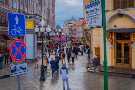MOSCOW, RUSSIA- APRIL, 24, 2018: Above view of crowd of people walking in the streets decorated for the celebration of Easter, informative signs and some lampsのeditorial素材