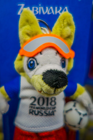 ST. PETERSBURG, RUSSIA, 02 MAY 2018: Close up of gifts in the form of toy with a picture the official mascot of the 2018 FIFA World Cup, the wolf Zabivaka inside of souvenir shopのeditorial素材