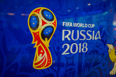 ST. PETERSBURG, RUSSIA, 02 MAY 2018: Official logo FIFA World Cup 2018 in Russia printed on a blue background, inside of an officil shop storeのeditorial素材