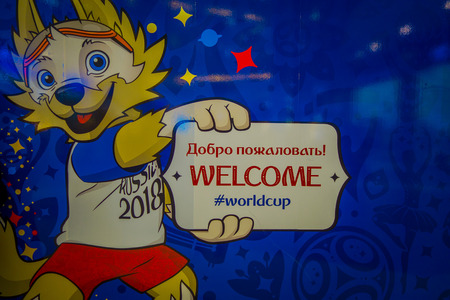 ST. PETERSBURG, RUSSIA, 02 MAY 2018: The official mascot of the 2018 FIFA World Cup wolf Zabivaka on the theatrical square Park of football holding a welcome sign in the pictureのeditorial素材