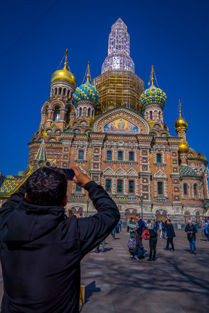 ST. PETERSBURG, RUSSIA, 02 MAY 2018: Unidentified people taking pictures of the Church the Savior on Spilled Blood is one of the main sights of St.Petersburg, the church was built in 1883-1907のeditorial素材
