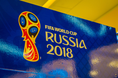 ST. PETERSBURG, RUSSIA, 02 MAY 2018: Official logo FIFA World Cup 2018 in Russia printed on a blue background, inside of an officil shop storeのeditorial素材