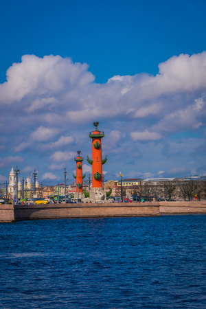 ST. PETERSBURG, RUSSIA, 01 MAY 2018: Rostral column in historical city center, popular touristic landmark, UNESCO World Heritage Site with Peter and Paul Fortress in the horizontのeditorial素材