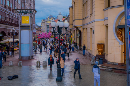 MOSCOW, RUSSIA- APRIL, 24, 2018: Above view of crowd of people walking in the streets decorated for the celebration of Easter, informative signs and some lampsのeditorial素材
