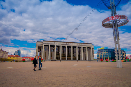MINSK, BELARUS - MAY 01, 2018: Outdoor view of tourists walking in the Palace of the Republic is a Belarusian cultural and business center located on the October Square of Minskのeditorial素材