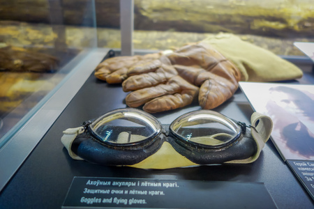 BELARUS, MINSK - MAY 01, 2018: Close up of selective focus of glasses and gloves inside of a glass box in State Museum of the Great Patriotic War exhibitions of the museum in Minskのeditorial素材