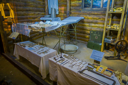 BELARUS, MINSK - MAY 01, 2018: Indoor view of tools used during medical practice during war, inside of small huts of atention in Great Patriotic War exhibits of the museum, in Minskのeditorial素材