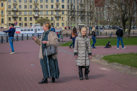 ST. PETERSBURG, RUSSIA, 02 MAY 2018: Unidentified people walking and taking pictures of the lanscape at riverside of Moyka River in St. Petersburg in a gorgeous sunny dayのeditorial素材