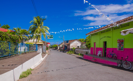 OMETEPE, NICARAGUA, MAY, 14, 2018: Outdoor view of wooden colorful buildings located in the city of Ometepe Island in a gorgeous sunny dayのeditorial素材