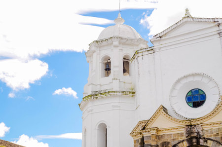 POPAYAN, COLOMBIA - APRIL 27, 2018: Outdoor view of Santo Domingo church in colonial city Popayan