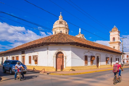 GRANADA, NICARAGUA, MAY, 14, 2018: Beautiful outdoor view of row of colorful houses in central city in dowtown, in a gorgeous sunny day and blue sky background in Granadaのeditorial素材