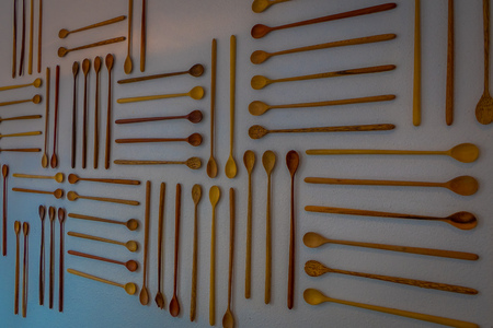 Indoor view of wooden assorted spons hangin in a white wall, inside of a building, store of market in jackson hole in Usa.の写真素材