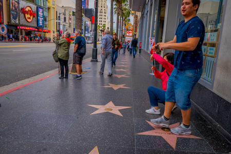 Los Angeles, California, USA, JUNE, 15, 2018: Unidentified tourists posing and taking pictures in walk of fame in Los Angeles. Hollywood Walk of Fame features more than 2,500 stars celibrity namesのeditorial素材