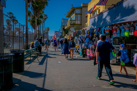 Los Angeles, California, USA, JUNE, 15, 2018: Outdoor view of unidentified people walk along the Venice Beach Boardwalk on a sunny summer dayのeditorial素材