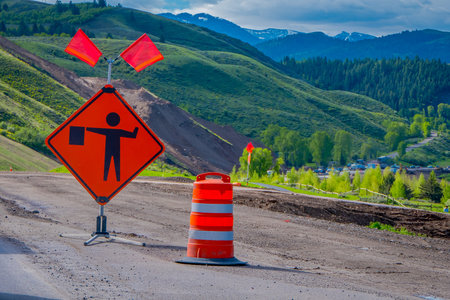 YELLOWSTONE NATIONAL PARK, WYOMING, USA - JUNE 07, 2018: Informative sign with red flags and red...