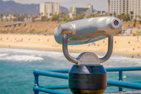 Los Angeles, California, USA, JUNE, 15, 2018: Close up of coin operated optical binocular, in Santa Monica pier with a blurred city backgroundのeditorial素材