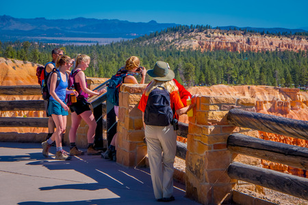 BRYCE CANYON, UTAH, JUNE, 07, 2018: Outdoor view of unidentified people taking pictures and enjoying the beautiful view of Bryce Canyon from the inspiration point viewer in National Park in Utahのeditorial素材