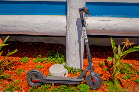 Los Angeles, California, USA, AUGUST, 20, 2018: Outdoor view of scooter laying over a wooden column in a house in Venice Beach in Santa Monica, is popular by domestic residents for relaxのeditorial素材