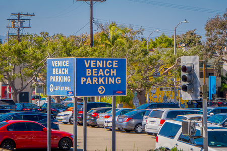 Los Angeles, California, USA, AUGUST, 20, 2018: Outdoor view of Venice Beach Parking area with some cars parked in Santa Monica, the ocean, and parking lot. Millions of people visit Santa Monica each yearのeditorial素材