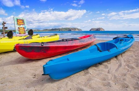 Samara, Costa Rica, June, 26, 2018: Outdoor view of colorful kayaks on the tropical beach of Samara in rental shop rady for intrepid tourists that love adventure in a gorgeous sunny dayのeditorial素材