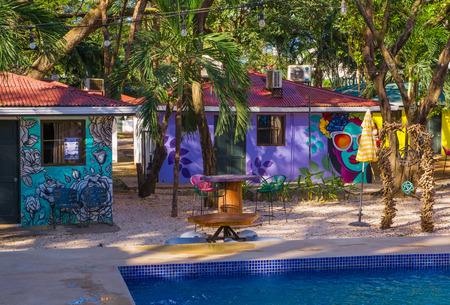 Tamarindo, Costa Rica, June, 26, 2018: Outdoor view of building hostal with a swimming pool in front, used to host tourists in Tamarindo beach in a gorgeous sunny dayのeditorial素材