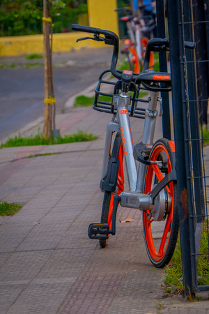 SANTIAGO, CHILE - SEPTEMBER 13, 2018: Bike parked at outdoors of the city in gorgeous beautiful sunny day i the dowtown of the city in Santiago, Chileのeditorial素材