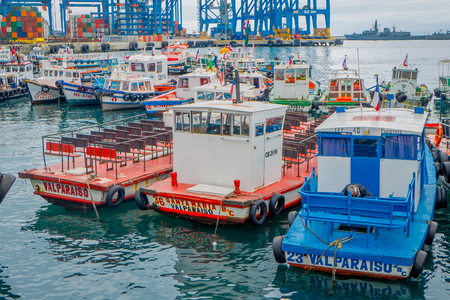 VALPARAISO, CHILE - SEPTEMBER, 15, 2018: Outdoor view of many boats and cranes docked in a harbor of Valparaisoのeditorial素材
