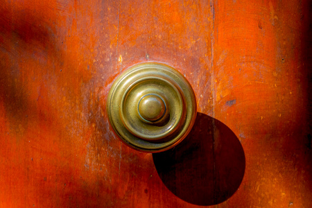 Close up selective focus of metallic structure in a wooden door located in the Barrio Yungay in Santiago, capital of Chileのeditorial素材