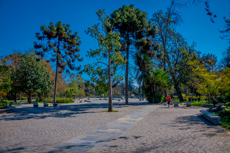 SANTIAGO, CHILE - SEPTEMBER 13, 2018: Unidentified tourists relaxing in the Yungay park located in the Barrio Yungay in Santiago, capital of Chileのeditorial素材