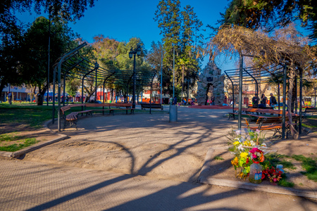 SANTIAGO, CHILE - SEPTEMBER 13, 2018: Outdoor view of unidentified people walking in the Yungay park located in the Barrio Yungay in Santiago, capital of Chileのeditorial素材