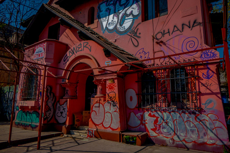 SANTIAGO, CHILE - SEPTEMBER 13, 2018: Outdoor view of old and partial destroyed pink house building located in the Barrio Yungay in Santiago, capital of Chileのeditorial素材