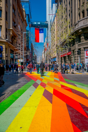 SANTIAGO, CHILE - SEPTEMBER 13, 2018: Outdoor view of crowd of people walking in the colorful streets the downtown surrounding of huge buildings in the city of Santiadoのeditorial素材