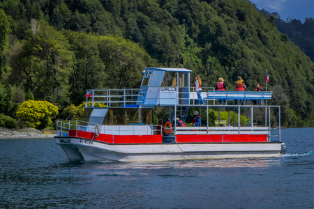 PUERTO VARAS, CHILE, SEPTEMBER, 23, 2018: Outdoor view of huge boat with tourists around the Lake Todos Los Santos, Region in Chileのeditorial素材