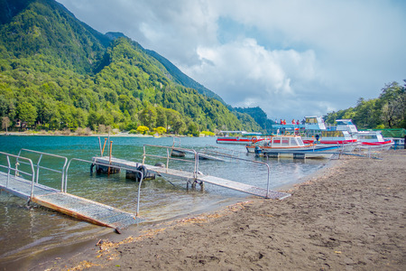 PUERTO VARAS, CHILE, SEPTEMBER, 23, 2018: Outdoor view of boats on the shore of Lake Todos Los Santos, Region in Chileのeditorial素材