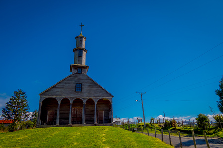 CHILOE, CHILE - SEPTEMBER, 27, 2018: Exterior view of quinchao church, one of world heritage wooden churches located at Chiloe island, south of Chile in beautiful sunny day with blue sky backgroundのeditorial素材