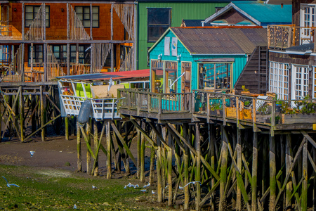 CHILOE, CHILE - SEPTEMBER, 27, 2018: Houses on stilts palafitos in Castro, Chiloe Island, Patagoniaのeditorial素材