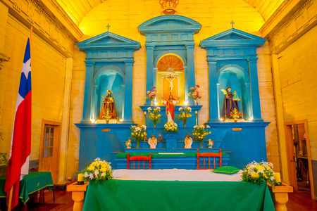 CHILOE, CHILE - SEPTEMBER, 27, 2018: Indoor view of saints and jesus structures inside of church in Nercon, recognized as a World Heritage Site by Unescoのeditorial素材