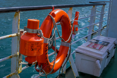 CHILOE, CHILE - SEPTEMBER, 27, 2018: Outdoor view of orange lifesaver inside of ferry in the mainland of Chileのeditorial素材
