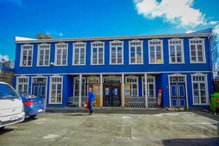CHILOE, CHILE - SEPTEMBER, 27, 2018: Outdoor view of blue wooden building in Chiloe island in a gorgeous blue sky in Chileのeditorial素材
