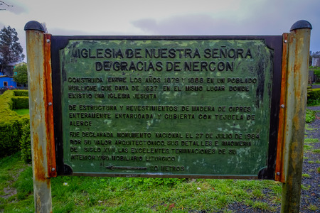 CHILOE, CHILE - SEPTEMBER, 27, 2018: Close up of informative sign of detail information about the historic church of Nercon, catholic temple, recognized as a World Heritage Site by Unescoのeditorial素材