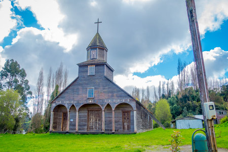 CHILOE, CHILE - SEPTEMBER, 27, 2018: Exterior view of quinchao church, one of world heritage wooden churches located at Chiloe island, south of Chile in beautiful sunny day with blue sky backgroundのeditorial素材