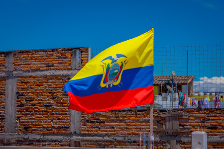OTAVALO, ECUADOR, NOVEMBER 06, 2018: Ecuadorian flags waving in a gorgeous sunny day in Otavaloのeditorial素材