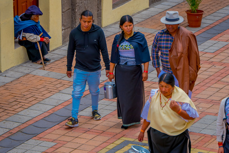 COTACACHI, ECUADOR, NOVEMBER 06, 2018: Unidentified people walking in the sidewak, of the city of Cotacachiのeditorial素材