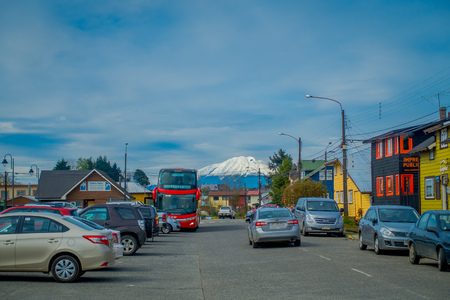 PUERTO VARAS, CHILE, SEPTEMBER, 23, 2018: Outdoor view of some cars parked at one side of the street with volcano Osorno background located in Puerto Varas in Chileのeditorial素材