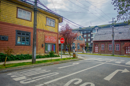 PUERTO VARAS, CHILE, SEPTEMBER, 23, 2018: Outdoor view of yellow wooden house building located in Puerto Varas in Chileのeditorial素材