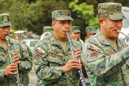 Quito, Ecuador - September, 03, 2018: Unidentified people wearing uniform in national military parade and playing the flute during the diablada festivalのeditorial素材