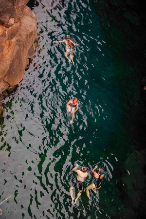Puerto Ayora, Galapagos, Ecuador - November 25, 2018: Above view of people swimming in Las Grietas on Santa Cruz Island in Galapagos. It is popular tourist destinationのeditorial素材