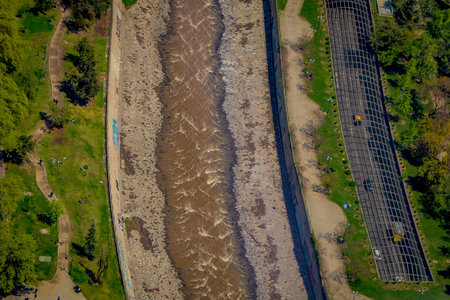 Outdoor view of canal of water at one side of the city located in Santiago city landscape from...